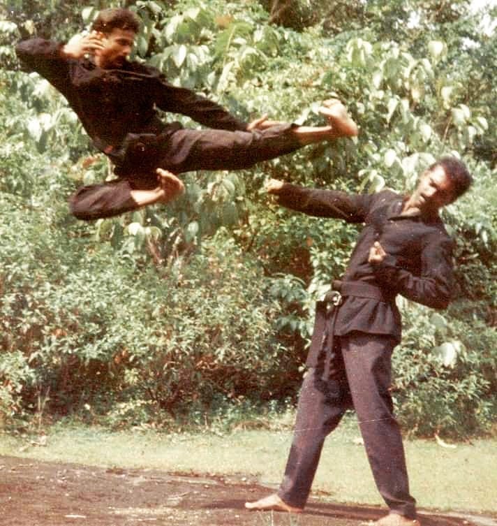Martial artist practicing traditional kata forms with precise technique and concentration