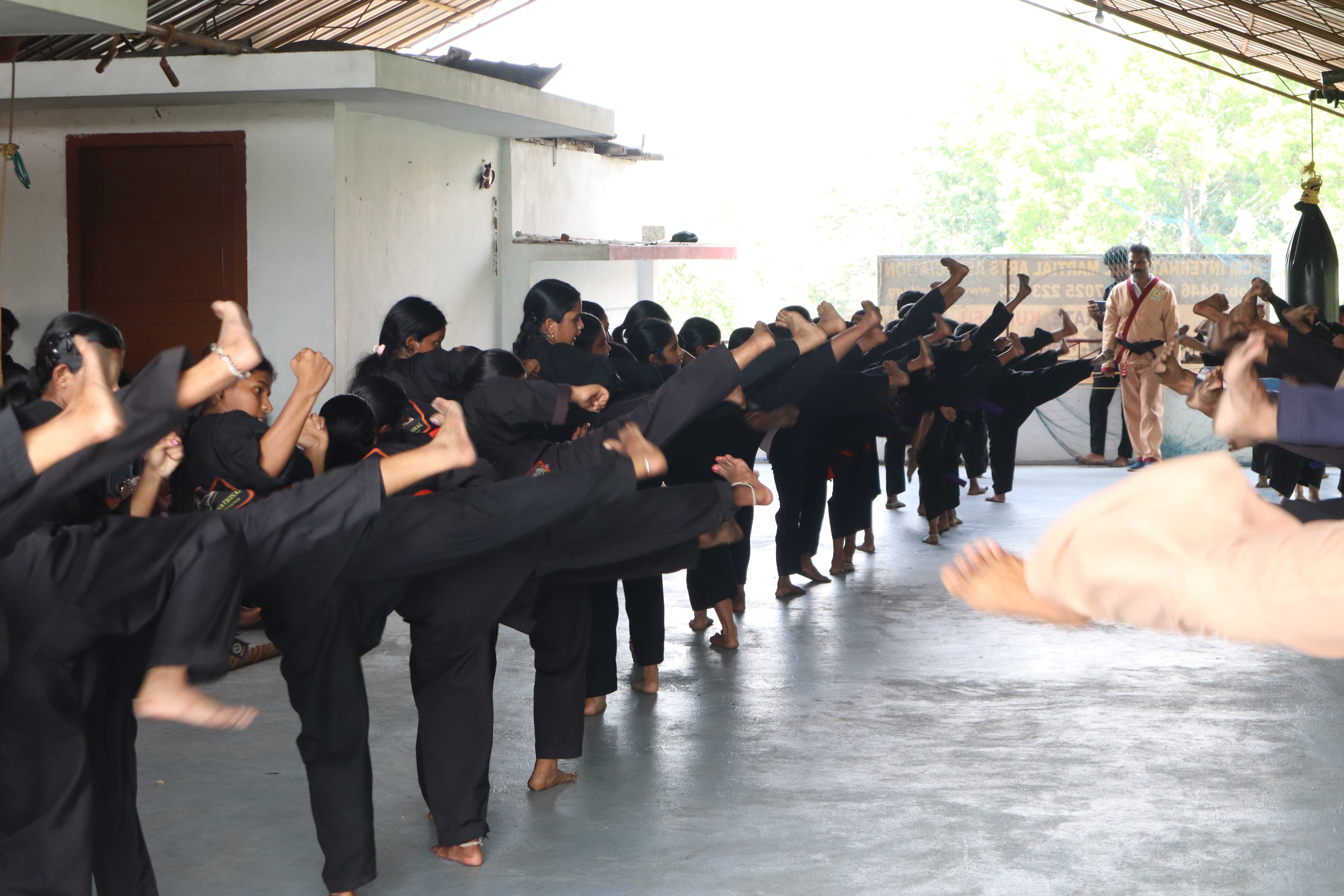 Young martial arts student showing intense focus and dedication during training session